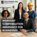 Group of four professionals posing for a photo in an office setting, with a focus on workers' compensation insurance.