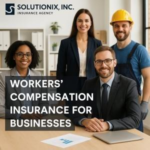 A group of four professionals posing for a photo in an office setting, with a focus on workers' compensation insurance.