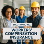 Group of professionals in safety helmets and business attire posing for a photo related to workers' compensation insurance.